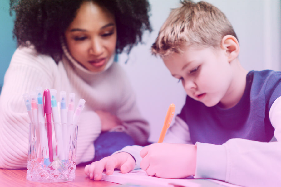 A One To One Session Of A Tutor With Student, Paying Close Attention.